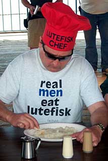 Man eating lutefisk